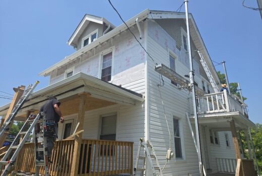 Siding repair being performed on a residential home