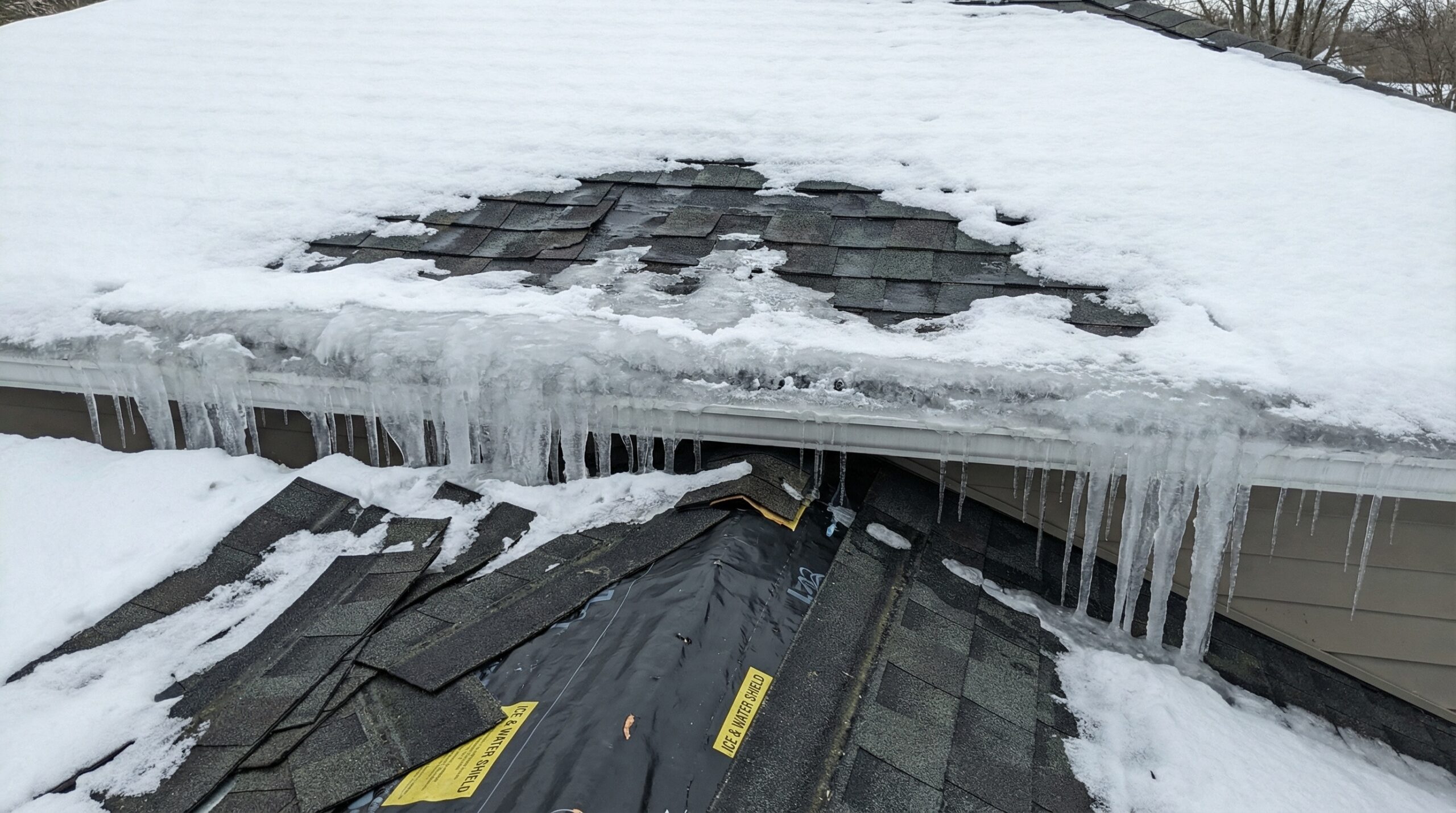 Before and after comparison showing a roof section with ice dam damage versus a protected area with ice and water shield