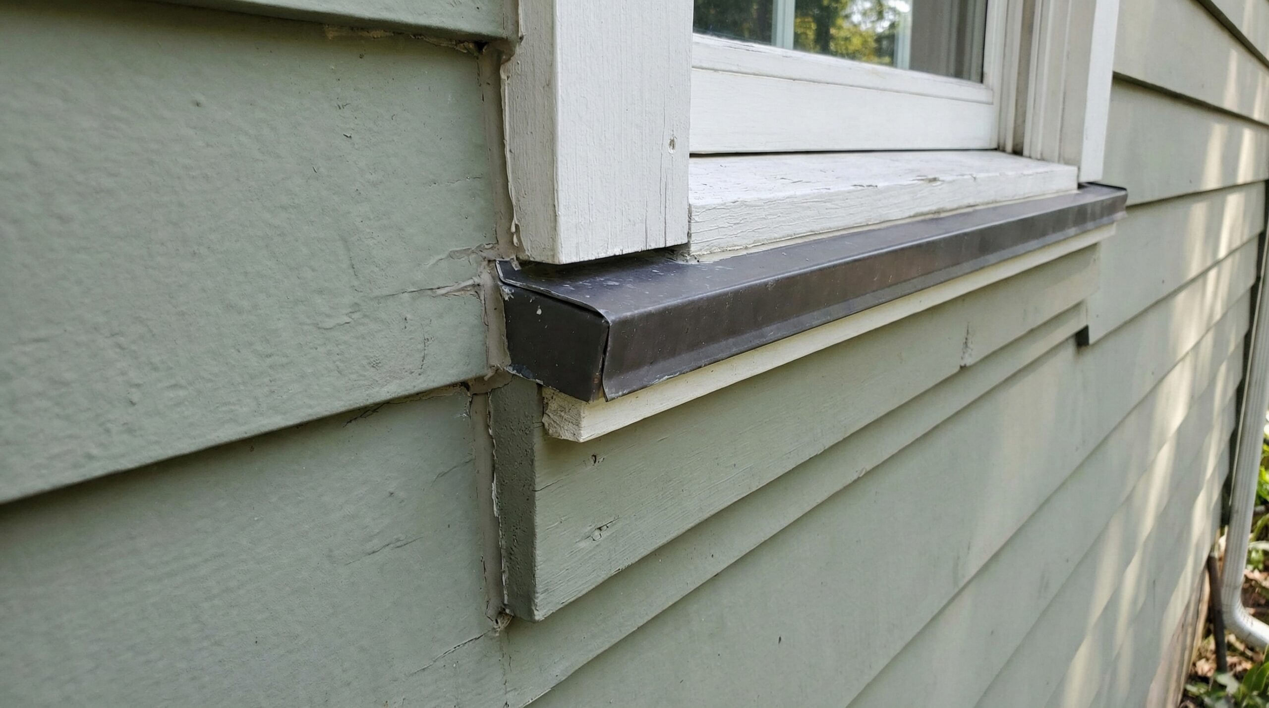 Close-up of properly installed siding with flashing and trim details