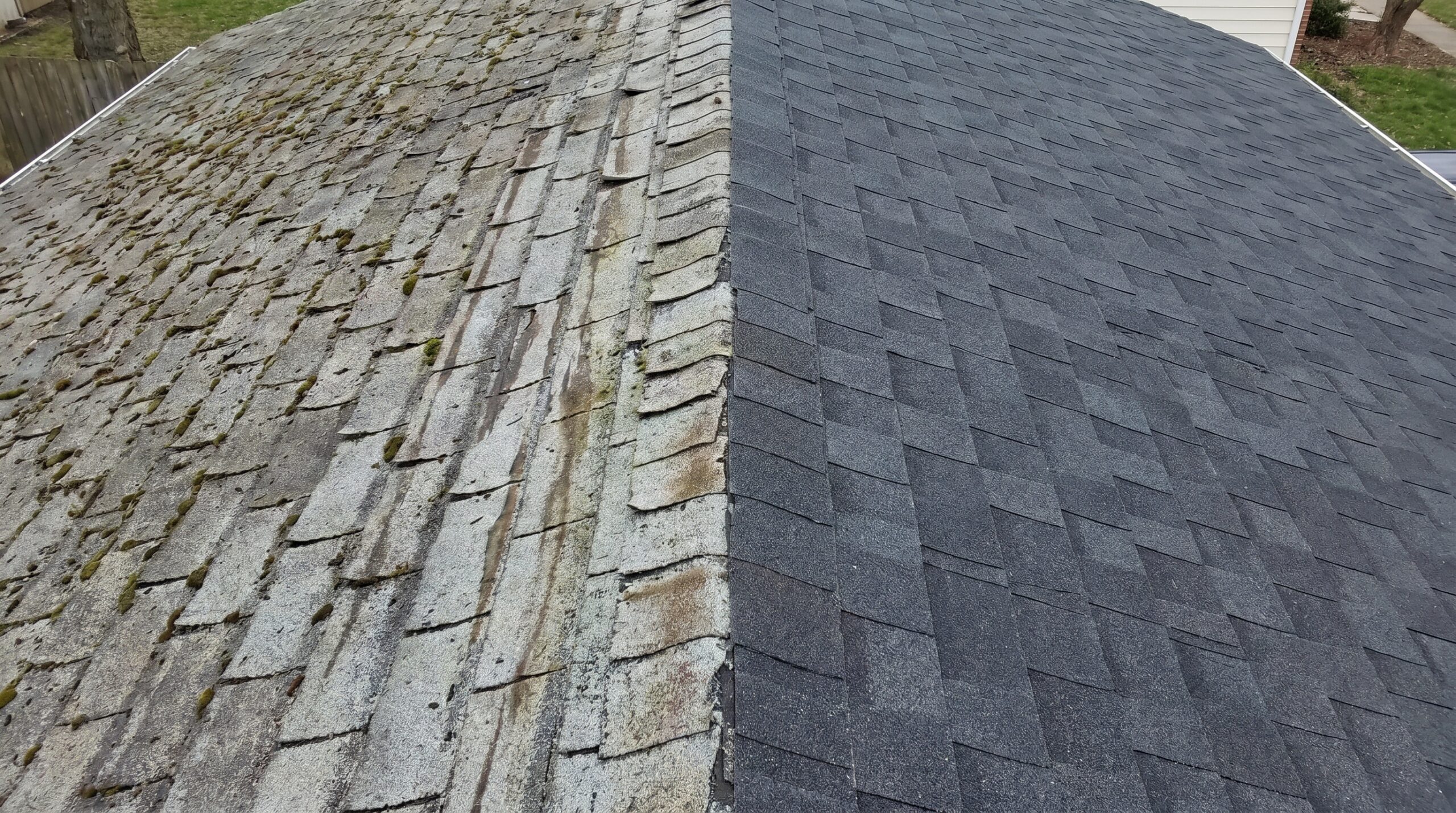 side by side comparison old weathered shingles new replacement shingles showing color difference